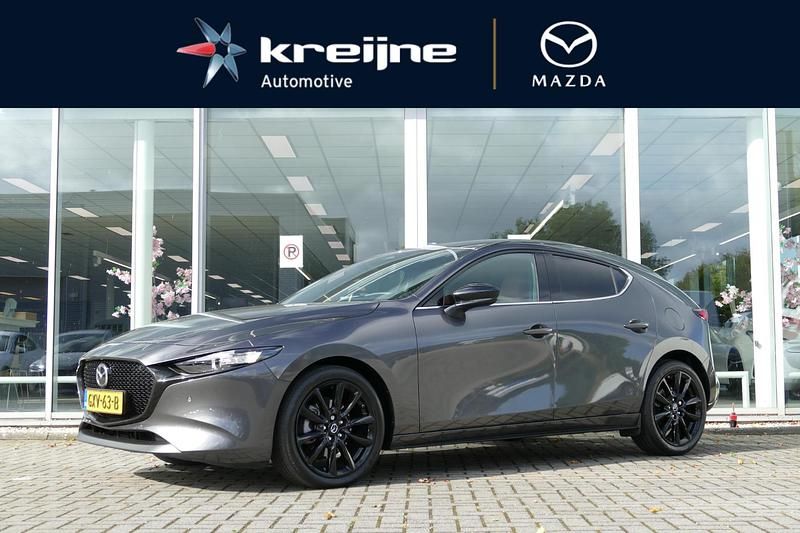 Machine grey Occasion 2024 Mazda 3 Nagisa Hatchback | € 32.925 (Eerlijke prijs) - Afbeelding 1/4