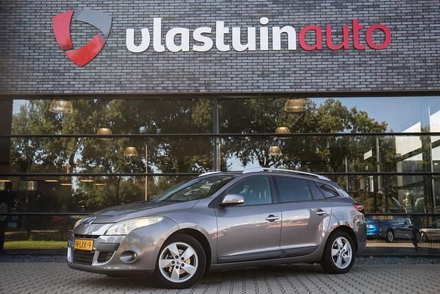 Grijs, metallic lak Gebruikt 2010 Renault Mégane GrandTour Dynamique Stationwagen | € 2.950 (Goede deal) - Afbeelding 1/4