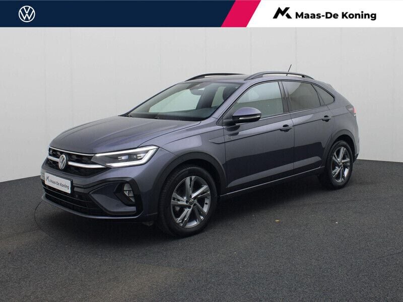 Grijs, metallic lak Gebruikt 2024 VW Taigo R-line SUV | € 28.940 (Eerlijke prijs) - Afbeelding 1/4