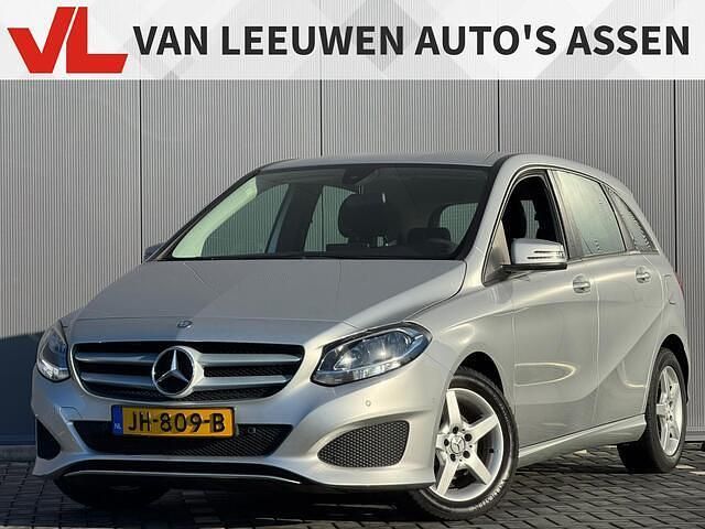 Grijs Gebruikt 2015 Mercedes B180 Ambition MPV | € 11.448 (Eerlijke prijs) - Afbeelding 1/4
