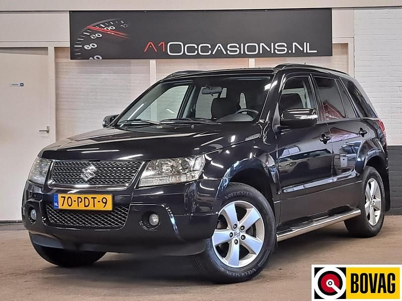 Zwart Gebruikt 2011 Suzuki Grand Vitara Exclusive SUV | € 10.495 - Afbeelding 1/4