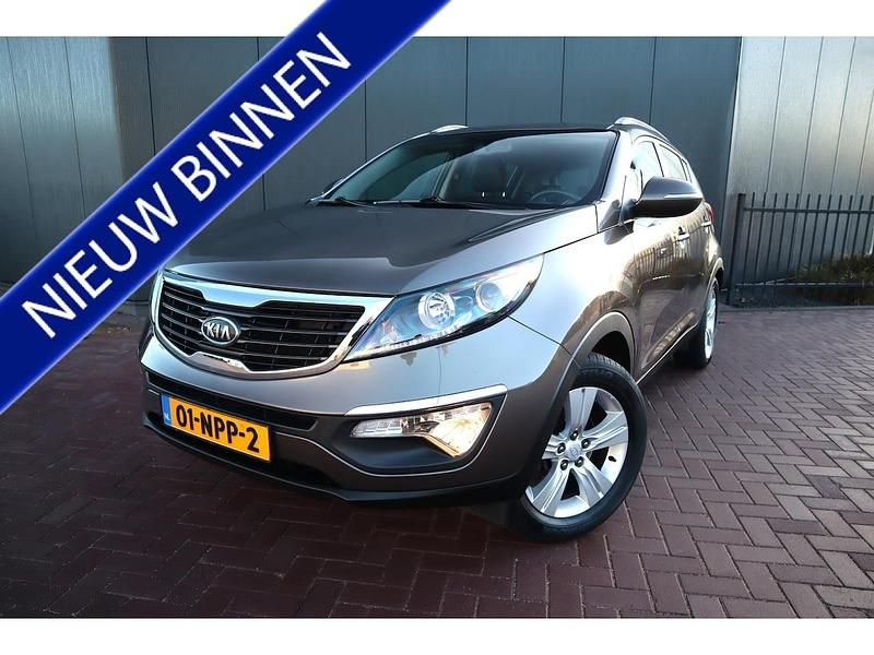 Bruin Occasion 2011 Kia Sportage Plus SUV | € 7.950 (Eerlijke prijs) - Afbeelding 1/4