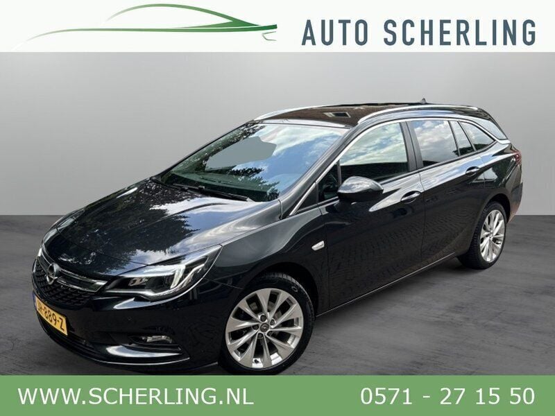 Zwart, metallic lak Gebruikt 2016 Opel Astra Edition Stationwagen | € 9.850 (Eerlijke prijs) - Afbeelding 1/4