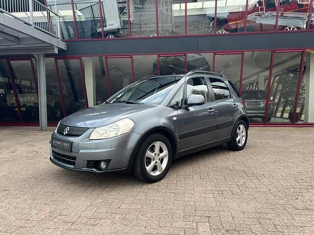 Grijs Gebruikt 2009 Suzuki SX4 MPV | € 3.450 (Goede deal) - Afbeelding 1/4