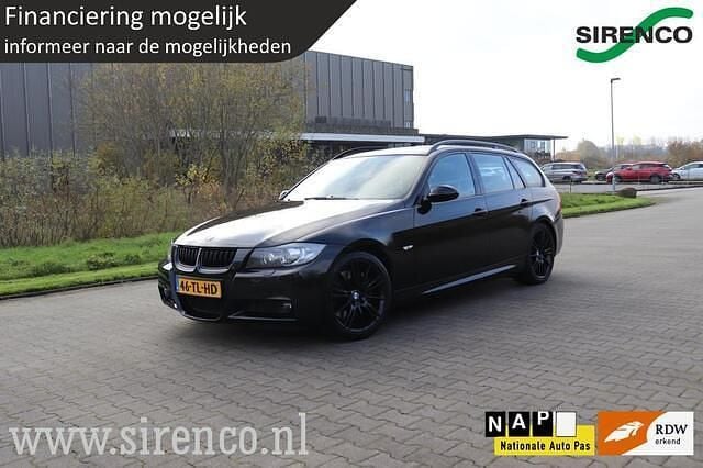 Zwart (metallic) Gebruikt 2006 BMW 335 Executive Stationwagen | € 11.999 (Goede deal) - Afbeelding 1/4