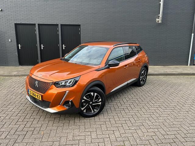 Oranje Gebruikt 2022 Peugeot e-2008 Allure SUV | € 19.999 - Afbeelding 1/4