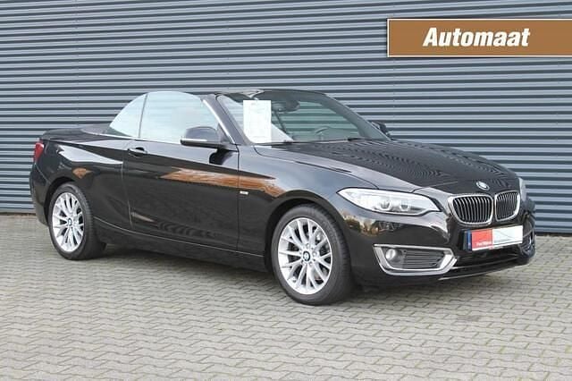 Zwart Gebruikt 2015 BMW 220 Luxury Line Cabriolet | € 15.950 (Eerlijke prijs) - Afbeelding 1/4