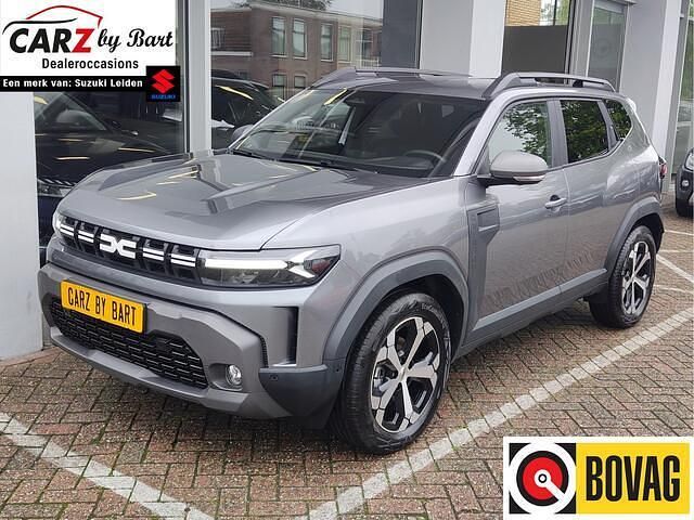 Grijs Gebruikt 2024 Dacia Duster Journey SUV | € 29.845 - Afbeelding 1/4
