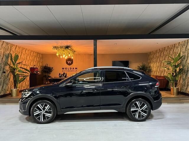 Zwart (metallic) Gebruikt 2021 VW Taigo Style SUV | € 22.990 (Eerlijke prijs) - Afbeelding 1/4