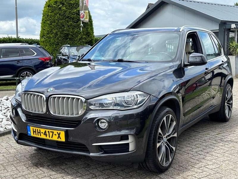 Grijs, metallic lak Gebruikt 2015 BMW X5 SUV | € 19.950 (Goede deal) - Afbeelding 1/4