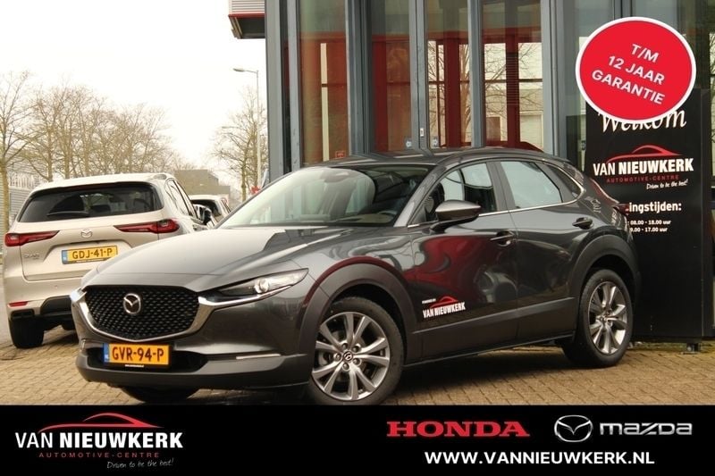 Machine grey (grijs mica) Gebruikt 2024 Mazda CX-30 Exclusive-Line SUV | € 34.400 (Eerlijke prijs) - Afbeelding 1/4