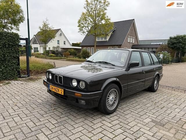Zwart Gebruikt 1991 BMW 325 Stationwagen | € 17.450 - Afbeelding 1/4