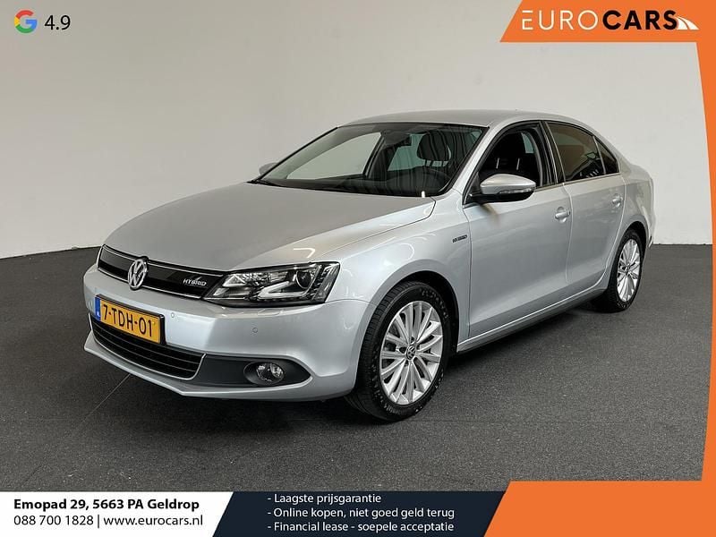 Grijs Gebruikt 2013 VW Jetta Hybrid Highline Sedan | € 7.990 (Eerlijke prijs) - Afbeelding 1/4