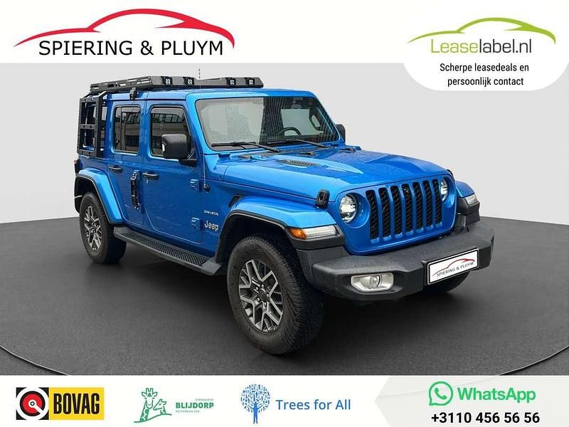 Blauw, metallic lak Gebruikt 2022 Jeep Wrangler Unlimited Sahara SUV | € 54.995 (Eerlijke prijs) - Afbeelding 1/4