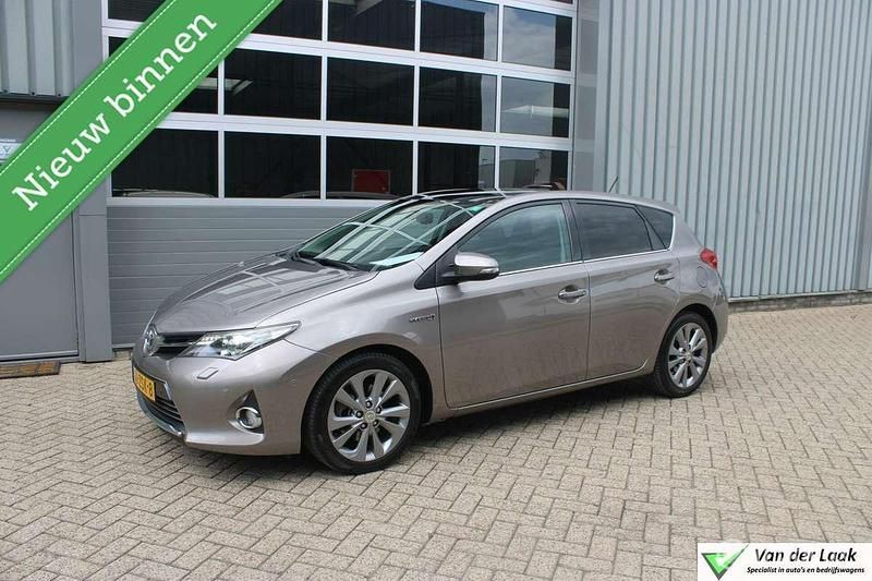 Bruin Gebruikt 2013 Toyota Auris Hybrid Hatchback | € 9.450 (Eerlijke prijs) - Afbeelding 1/4