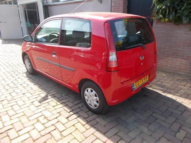 Occasion Daihatsu Cuore 59 PK (43 kW) 2007 Rood Hatchback