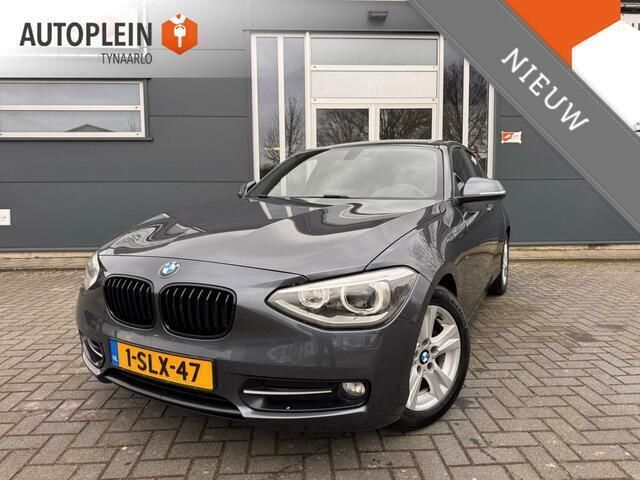 Grijs Gebruikt 2013 BMW 114 Executive Hatchback | € 9.495 (Eerlijke prijs) - Afbeelding 1/4