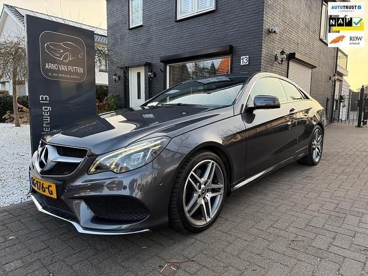 Grijs (metallic) Occasion 2015 Mercedes E200 Prestige Coupé | € 21.900 (Iets duurder) - Afbeelding 1/4