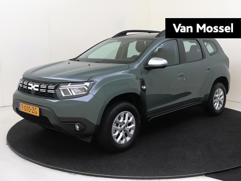 Grijs Gebruikt 2023 Dacia Duster Expression SUV | € 21.935 - Afbeelding 1/4