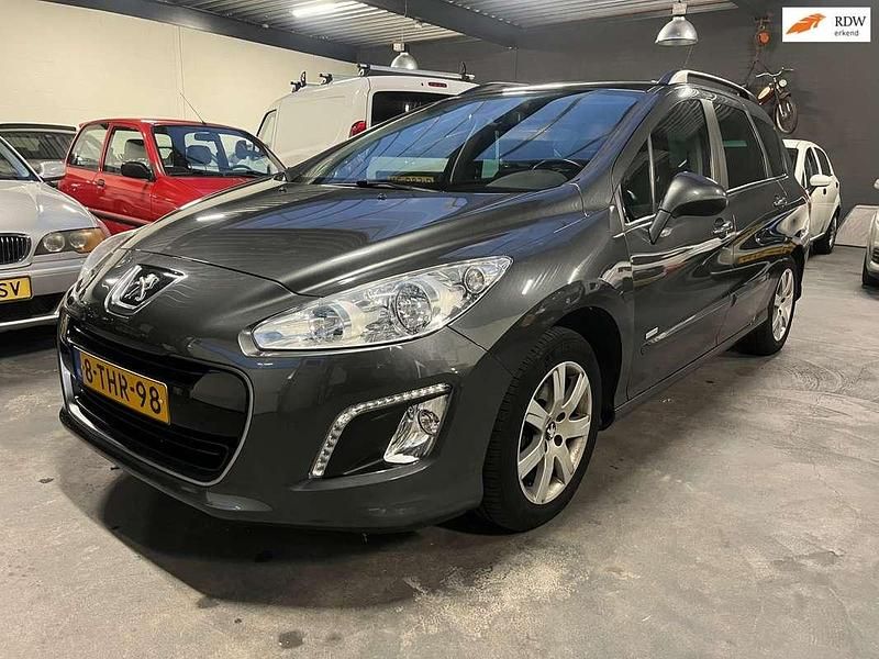 Grijs (metallic) Gebruikt 2014 Peugeot 308 SW Style Stationwagen | € 6.950 (Goede deal) - Afbeelding 1/4
