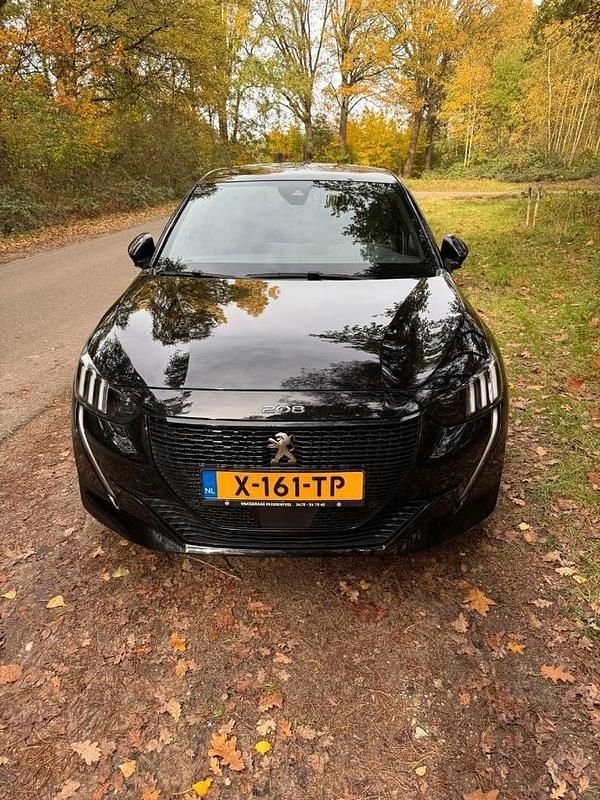 Zwart (metallic) Gebruikt 2023 Peugeot e-208 GT Hatchback | € 21.950 - Afbeelding 1/4