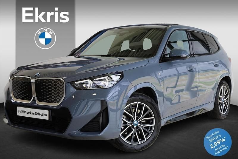 Grijs, metallic lak Gebruikt 2024 BMW iX1 M Sport SUV | € 46.750 (Iets duurder) - Afbeelding 1/4