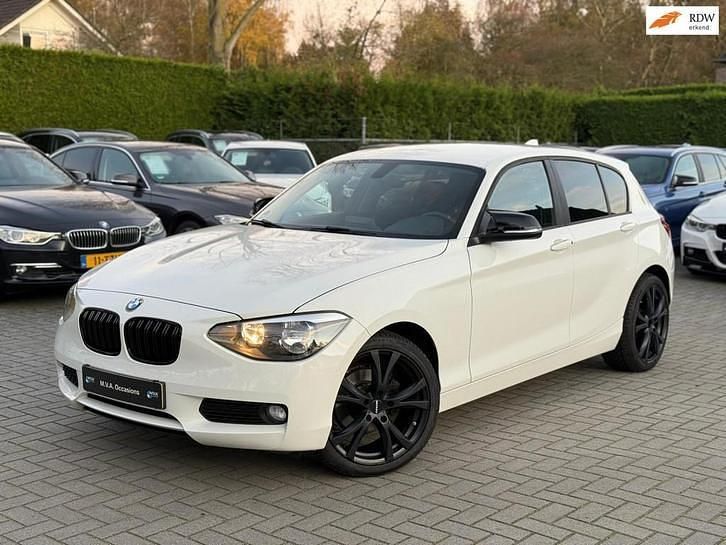 Wit Gebruikt 2014 BMW 114 Hatchback | € 9.950 (Duur) - Afbeelding 1/4