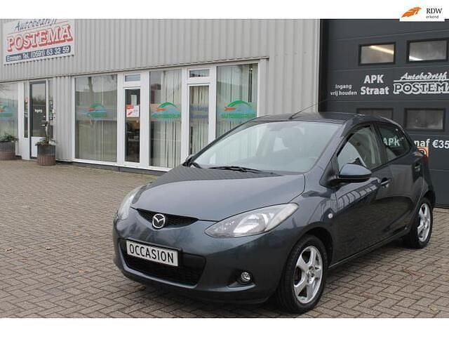 Grijs (metallic) Gebruikt 2007 Mazda 2 Hatchback | € 1.799 (Goede deal) - Afbeelding 1/4