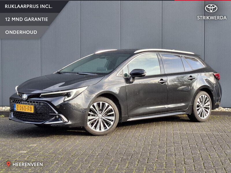 Zwart Gebruikt 2024 Toyota Corolla Hybrid Stationwagen | € 32.499 - Afbeelding 1/4