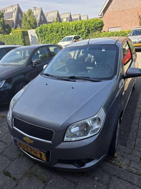 Grijs Gebruikt 2010 Chevrolet Aveo LS Hatchback | € 1.750 (Goede deal) - Afbeelding 1/4