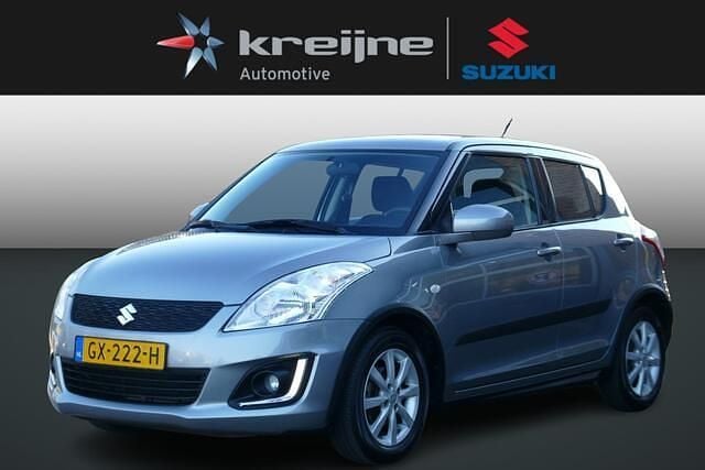 Grijs Occasion 2015 Suzuki Swift Hatchback | € 9.925 (Eerlijke prijs) - Afbeelding 1/4