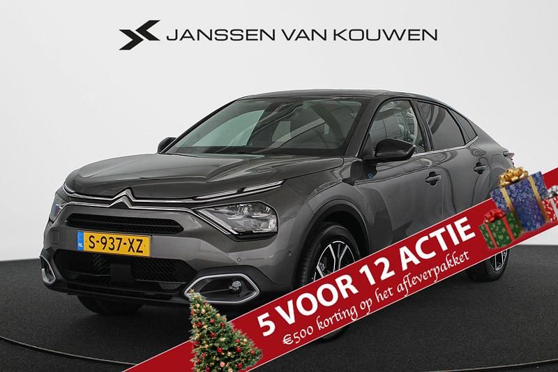 Grijs Gebruikt 2023 Citroën e-C4 Shine Sedan | € 21.745 (Eerlijke prijs) - Afbeelding 1/4