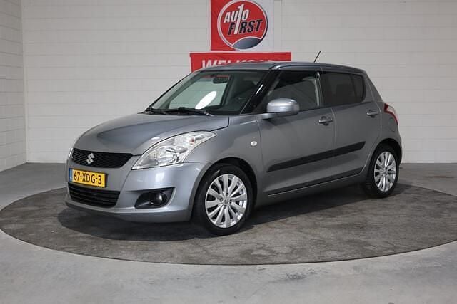 Grijs Occasion 2012 Suzuki Swift Exclusive Hatchback | € 7.950 (Eerlijke prijs) - Afbeelding 1/4