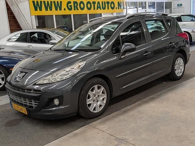 Grijs Gebruikt 2012 Peugeot 207 Active Stationwagen | € 3.744 (Goede deal) - Afbeelding 1/4