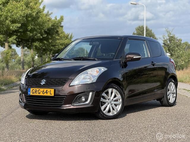 Bruin Gebruikt 2015 Suzuki Swift Exclusive Hatchback | € 7.250 (Eerlijke prijs) - Afbeelding 1/4