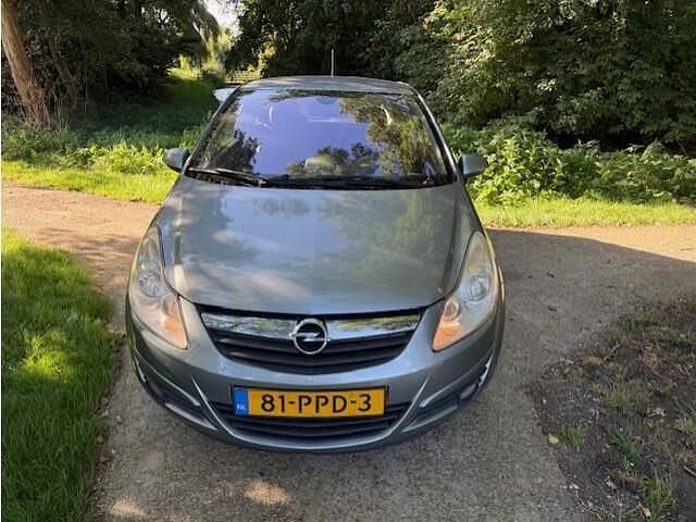 Grijs Gebruikt 2011 Opel Corsa Cosmo Hatchback | € 1.695 (Goede deal) - Afbeelding 1/4