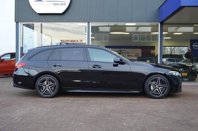 Occasion Mercedes C200 AMG line 204 PK (150 kW) 2021 Zwart Stationwagen