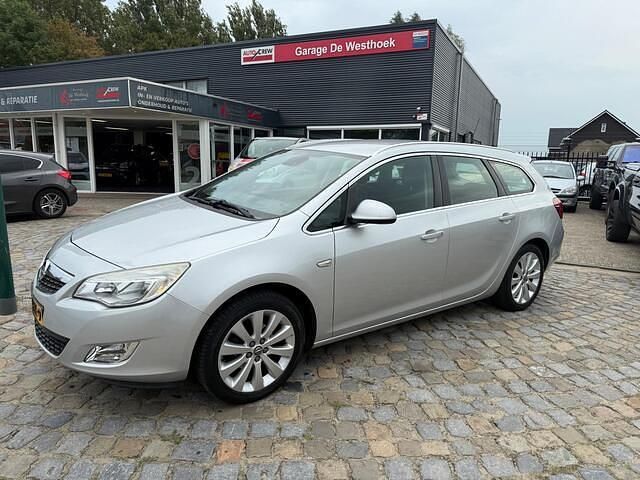 Grijs Gebruikt 2012 Opel Astra Cosmo Stationwagen | € 6.750 (Iets duurder) - Afbeelding 1/4