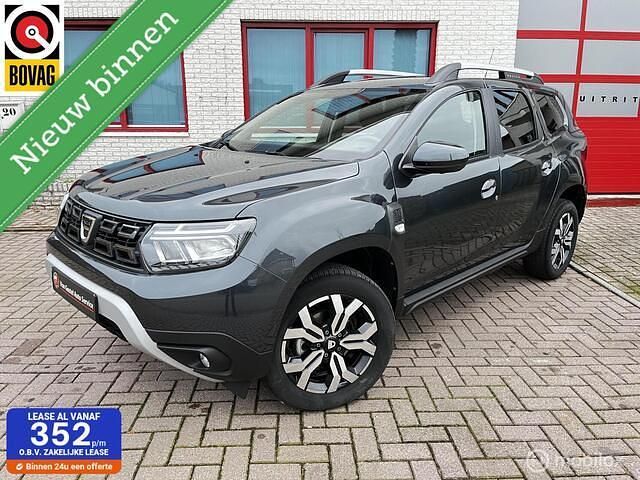Grijs (metallic) Gebruikt 2022 Dacia Duster SUV | € 21.750 (Goede deal) - Afbeelding 1/4