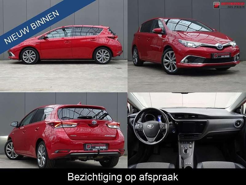 Rood (metallic) Gebruikt 2015 Toyota Auris Hybrid Executive Hatchback | € 13.450 (Eerlijke prijs) - Afbeelding 1/4