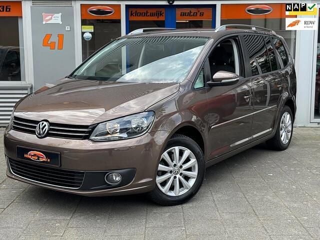 Bruin, metallic lak Gebruikt 2012 VW Touran Highline MPV | € 11.950 (Iets duurder) - Afbeelding 1/4