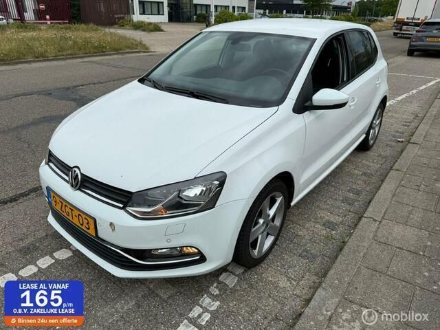 Wit Gebruikt 2015 VW Polo Highline Hatchback | € 9.995 (Eerlijke prijs) - Afbeelding 1/4