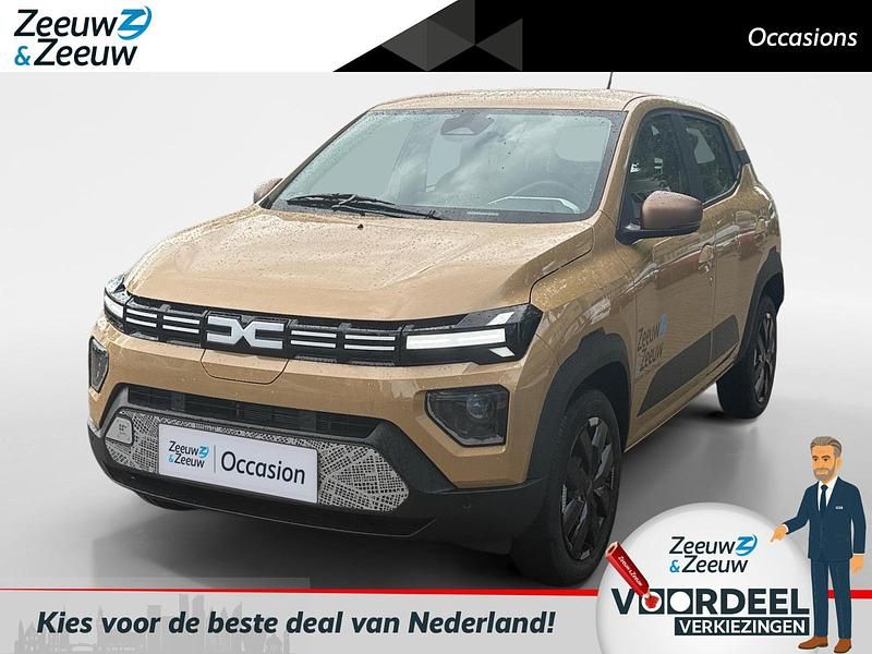 Bruin Nieuw 2025 Dacia Spring Extreme Hatchback | € 21.935 - Afbeelding 1/4