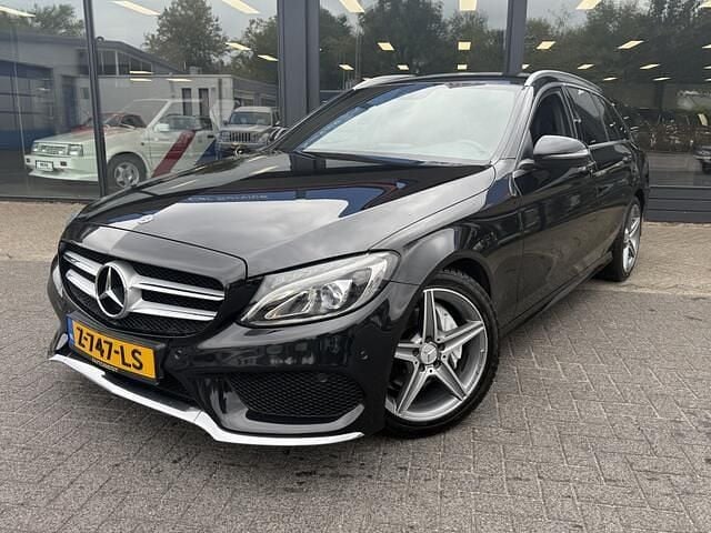 Zwart Gebruikt 2017 Mercedes C180 AMG Stationwagen | € 19.950 (Goede deal) - Afbeelding 1/4