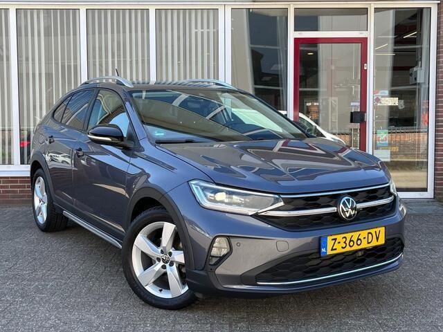 Grijs Gebruikt 2022 VW Taigo Style SUV | € 23.850 (Goede deal) - Afbeelding 1/4