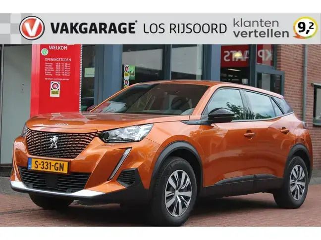 Oranje Gebruikt 2023 Peugeot e-2008 Active SUV | € 17.990 (Goede deal) - Afbeelding 1/4