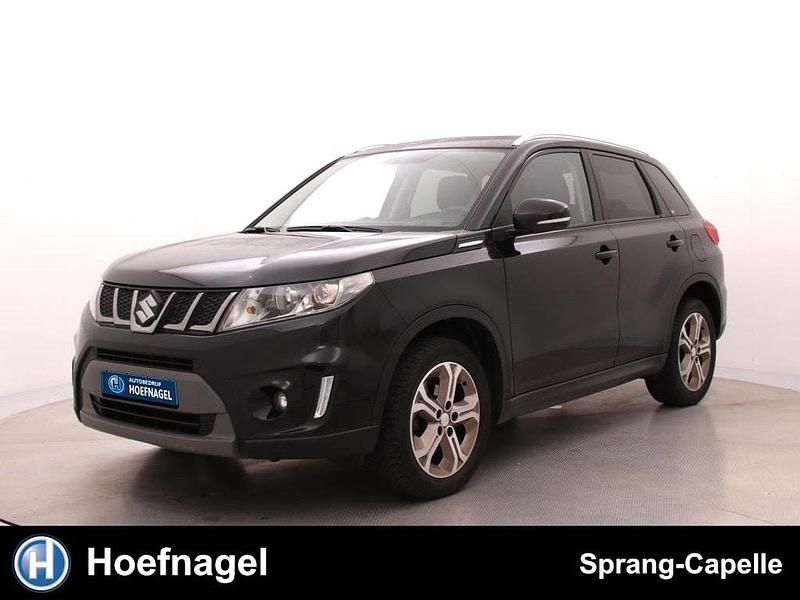 Zwart Gebruikt 2018 Suzuki Vitara Exclusive SUV | € 17.950 (Eerlijke prijs) - Afbeelding 1/3