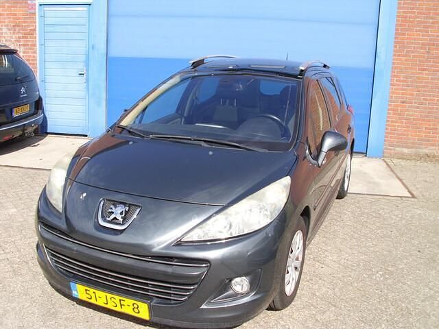 Grijs Occasion 2009 Peugeot 207 Stationwagen | € 1.500 (Eerlijke prijs) - Afbeelding 1/4