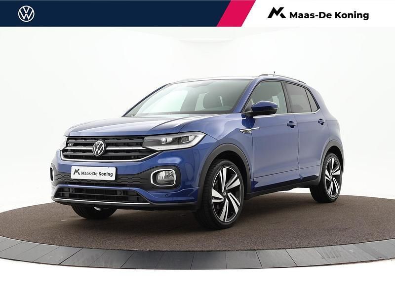 Blauw, metallic lak Gebruikt 2022 VW T-Cross R-line SUV | € 26.440 (Iets duurder) - Afbeelding 1/4