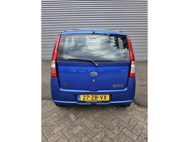 Occasion Daihatsu Cuore 59 PK (43 kW) 2008 Blauw, metallic lak Hatchback